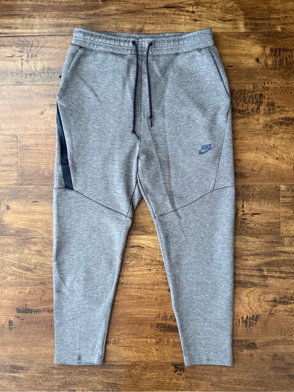 Gray Nike Tech Fleece Joggers with black side stripe